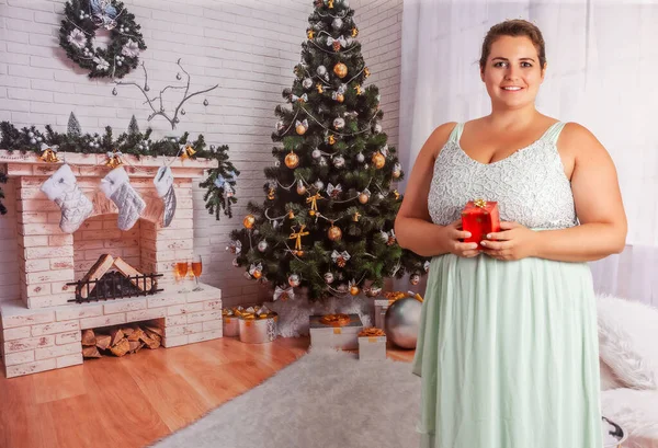 Overweight Elegant Woman Stands Christmassy Decorated Room Has Christmas Parcel — Stock Photo, Image
