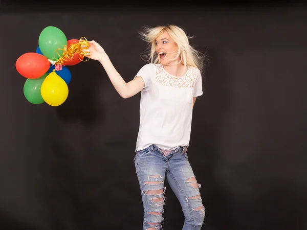 Young laughing woman with coloured aerial balloons — Stock Photo, Image