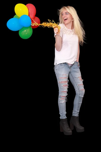 Portrait of a happy young woman with a bundle of balloons — Zdjęcie stockowe