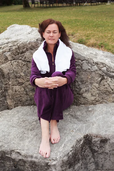 Woman Relaxing After Work Out on Large Rocks — 스톡 사진