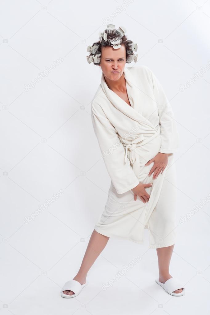 Woman in Robe and Slippers Posing with Pursed Lips