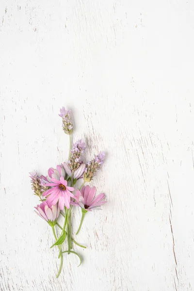 stock image closeup bunch of spring flowers on a wooden background with copy space