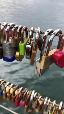 Bled, Slovenia - April 12, 2019; Hanged love locks on the fence by Bled lake in Slovenia