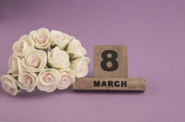 Sjabloon voor de dag van de vrouw met de agenda en bloem — Stockfoto