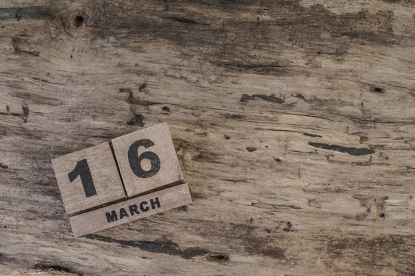 Cube calendar for march on wooden surface with copy space — Stock Photo, Image