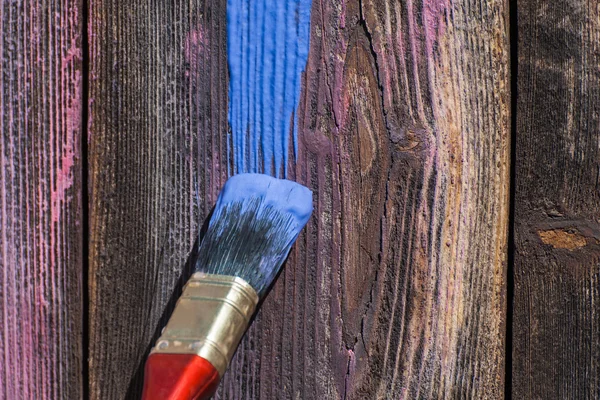 Paint smear on wooden background