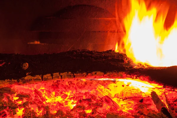 Burning billets in fireplace — Stock Photo, Image