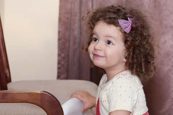Curly baby girl — Zdjęcie stockowe
