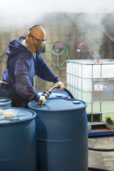 Working Chemical Blender in Corrosive Area of Plant Stock Photo