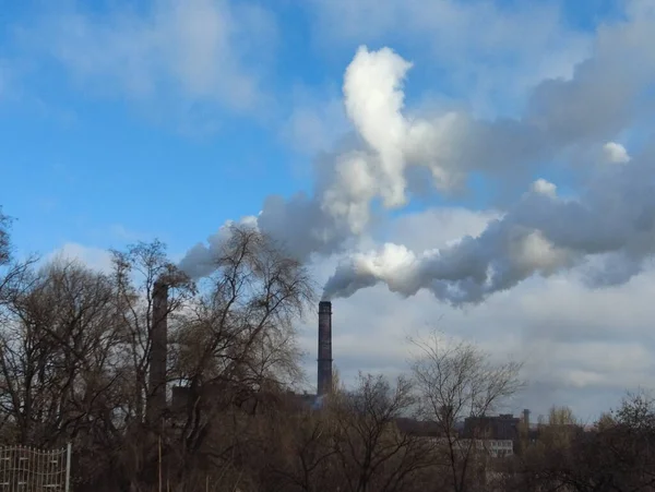 air pollution problems. smoke from the chimneys of the plant. dirty smoke on the background of the sky