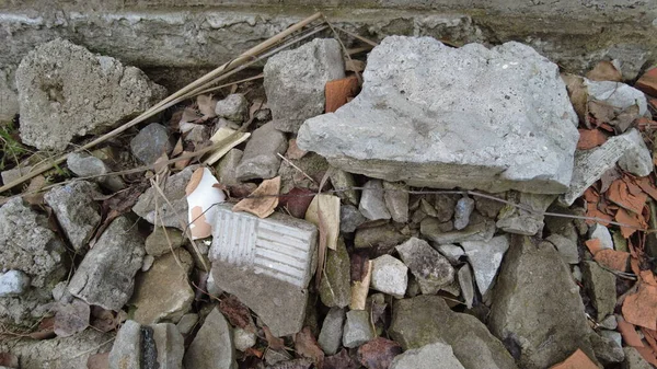 a pile of construction waste. broken brick and concrete. shards of red brick