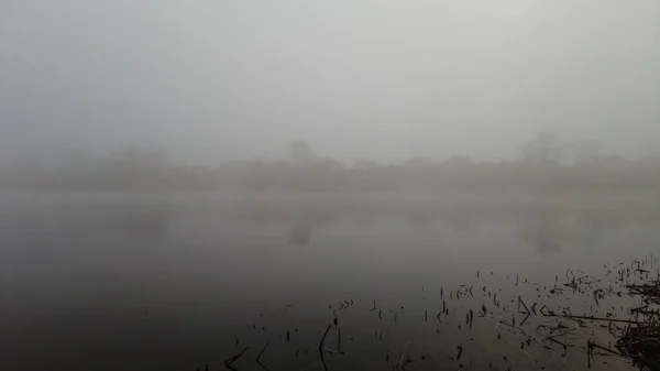 thick fog on the river. water in the fog. landscape with water and fog.