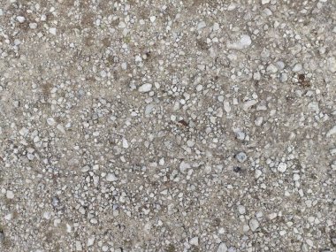 Yol dokusu. Gri taşlar. Çöplük sürtüğü. gri beton