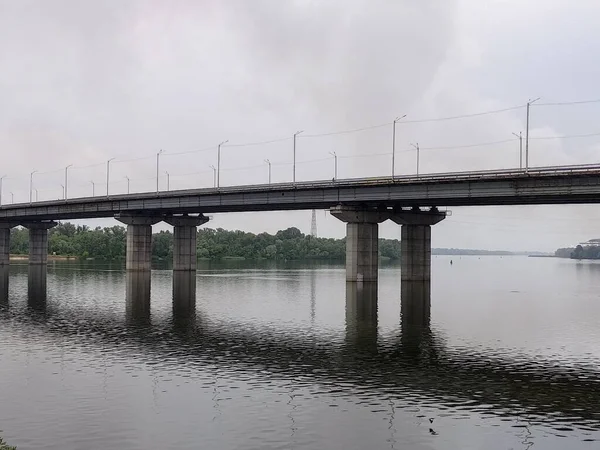 large concrete bridge. overpass over the water. bridge structures and supports