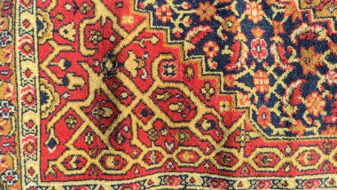 Halıdaki desen. Eski yün halı. Klasik el yapımı halı. Kumaştaki antik süs