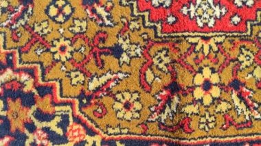 Halıdaki desen. Eski yün halı. Klasik el yapımı halı. Kumaştaki antik süs