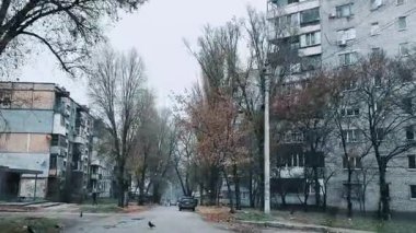 Old Soviet high-rise buildings in the city. Ukraine. Destroyed cities. Broken panel houses. Consequences of war. Destruction in the city. Mist-story old houses in autumn.