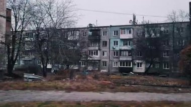 Old Soviet high-rise buildings in the city. Ukraine. Destroyed cities. Broken panel houses. Consequences of war. Destruction in the city. Mist-story old houses in autumn.