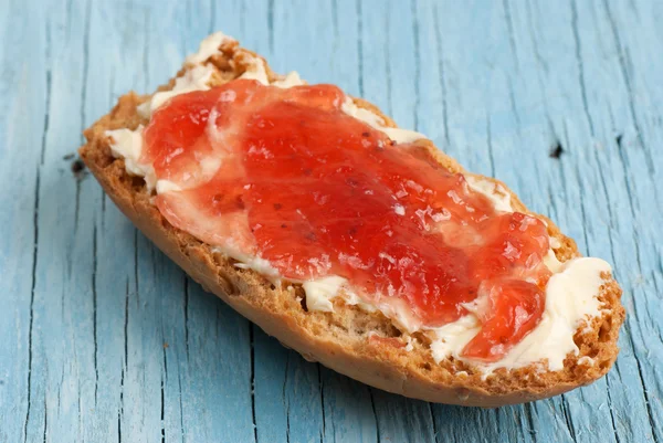 Rusk with butter and jam — Stock Photo, Image