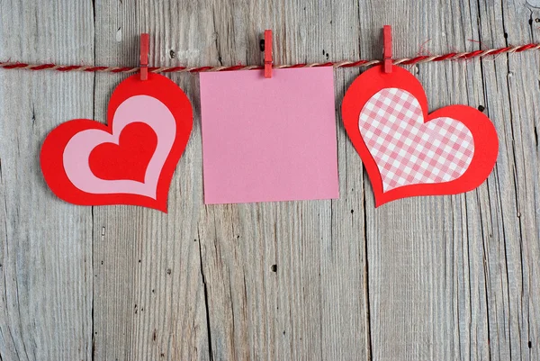 Paper hearts and blank note — Stock Photo, Image