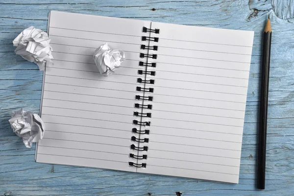 Notepad with pencil and crumpled papers — Stock Photo, Image