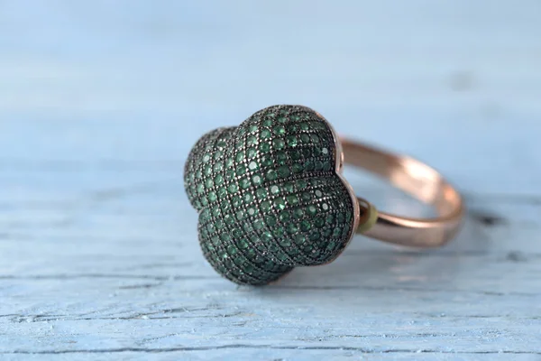 Jewelry ring on old wooden table — Stock Photo, Image