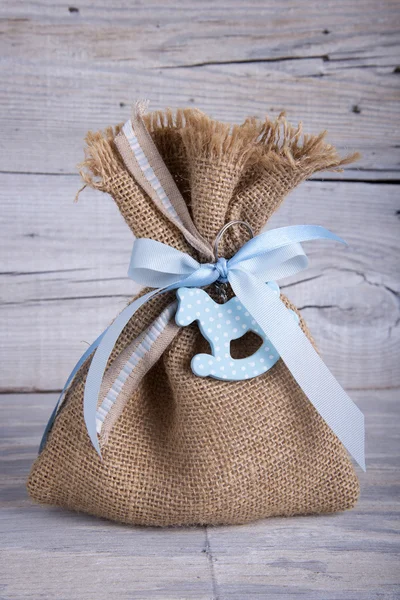 Burlap pouch tied with ribbon — Stock Photo, Image