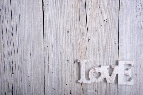 Word LOVE on old wooden background — Stock Photo, Image