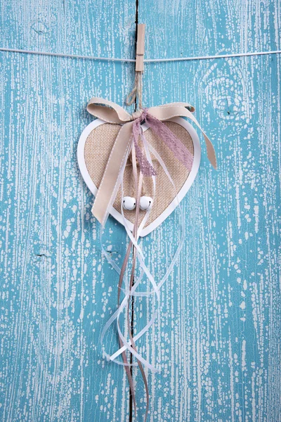 Wooden heart decoration with ribbons — Stock Photo, Image