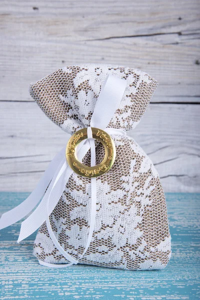 Burlap pouch tied with ribbon — Stock Photo, Image