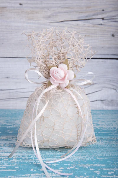 Wedding favor on old wooden table — Stock Photo, Image