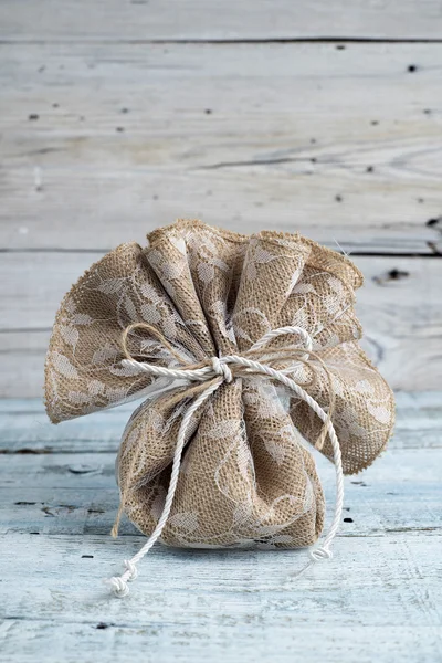 Burlap pouch tied with string — Stock Photo, Image