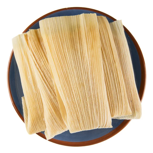 Tamales su piatto blu isolato — Foto Stock