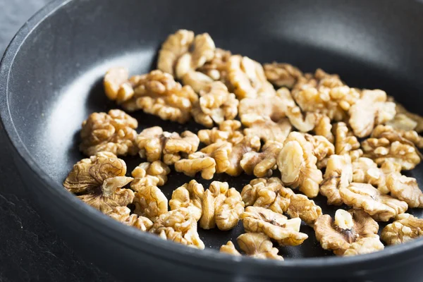 Toasting Walnuts. — Stock Photo, Image