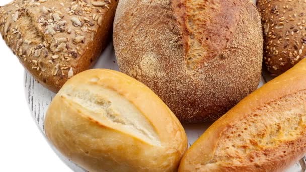 Breads and baked goods: Camera pans across large assortment in HD video — Stock Video