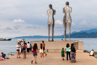 BATUMI, GEORGIA - JULY 7: Statue of Love Ali and Nino on July 7, 2015 in Batumi, Georgia. Steel Ali and Nino slowly moving towards each other every 10 minutes, as long as they meet and merge into one clipart