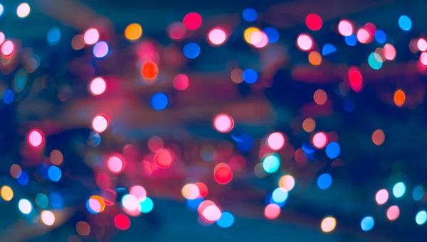 Fond de Noël. Fond abstrait festif avec des lumières et des étoiles bokeh déconcentrées — Photo
