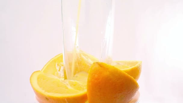 Orange juice pouring into glass — Stock Video