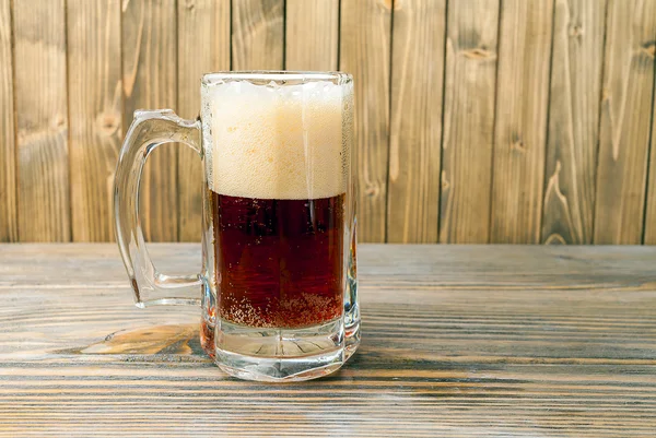 Cup of beer on wood — Stock Photo, Image