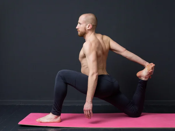 Young man  is doing front lunge — Stock Fotó