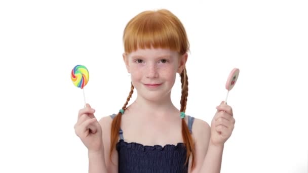 Little ginger girl with  lollypops — Stock Video