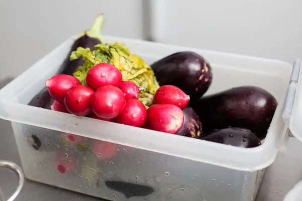 fresh vegetables in a plastic container
