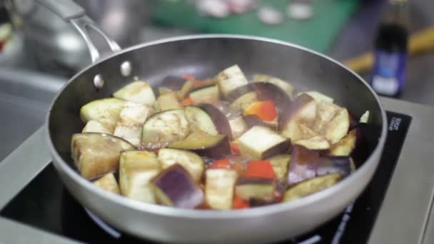 Eggplant ragout is being stewed in the pan — Stock Video