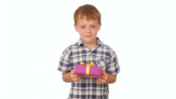 Little boy holding a box with a present — Stock Video