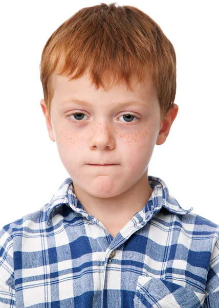 Pequeno menino sério em camisa quadriculada — Fotografia de Stock