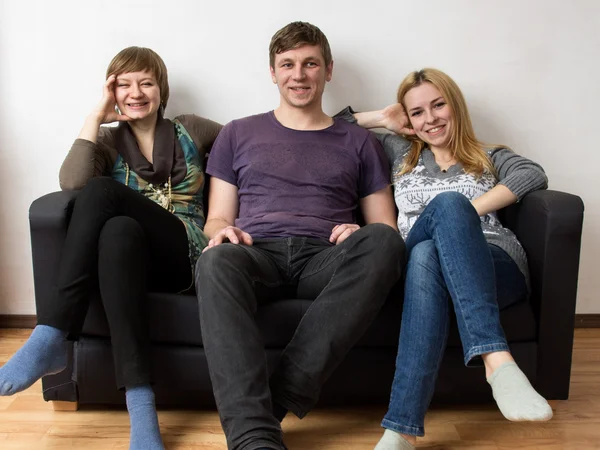 A man between two smiling girls — Stock Photo, Image