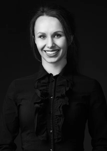 Woman  in black shirt with bright lipstick and broad smile — Stock fotografie