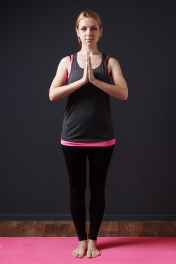  Calm meditative woman staying in  yoga asana clipart