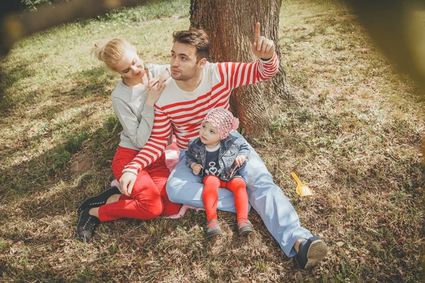 Happy young family outdoors — Stock Photo, Image