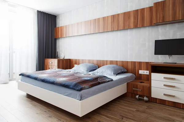 Modern bedroom in a wooden finish — Stock Photo, Image